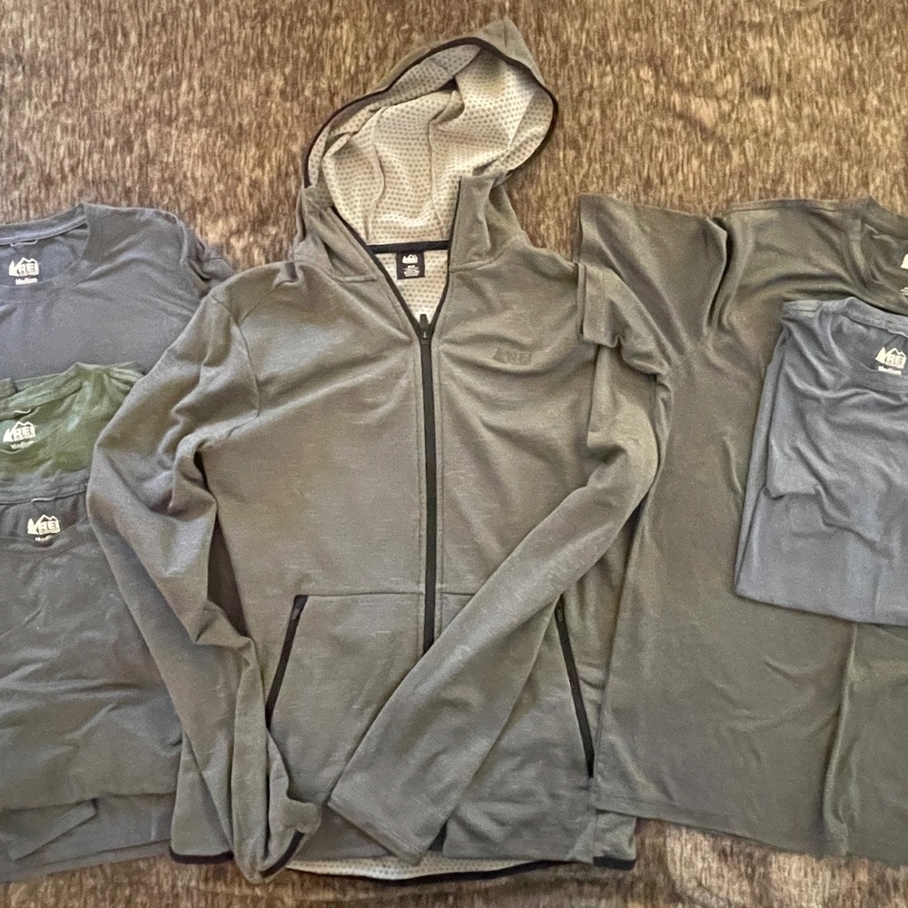 REI athletic zip-up hoody, 3 long sleeve t-shirts, and 2 t-shirts